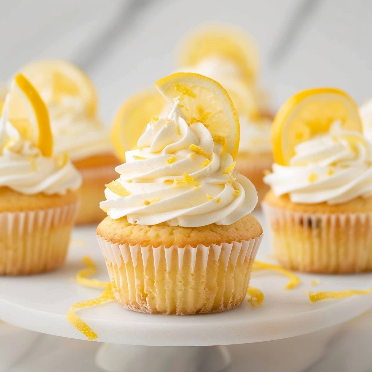 Moist, fluffy and zingy lemon cupcakes in a decorated kitchen stand 