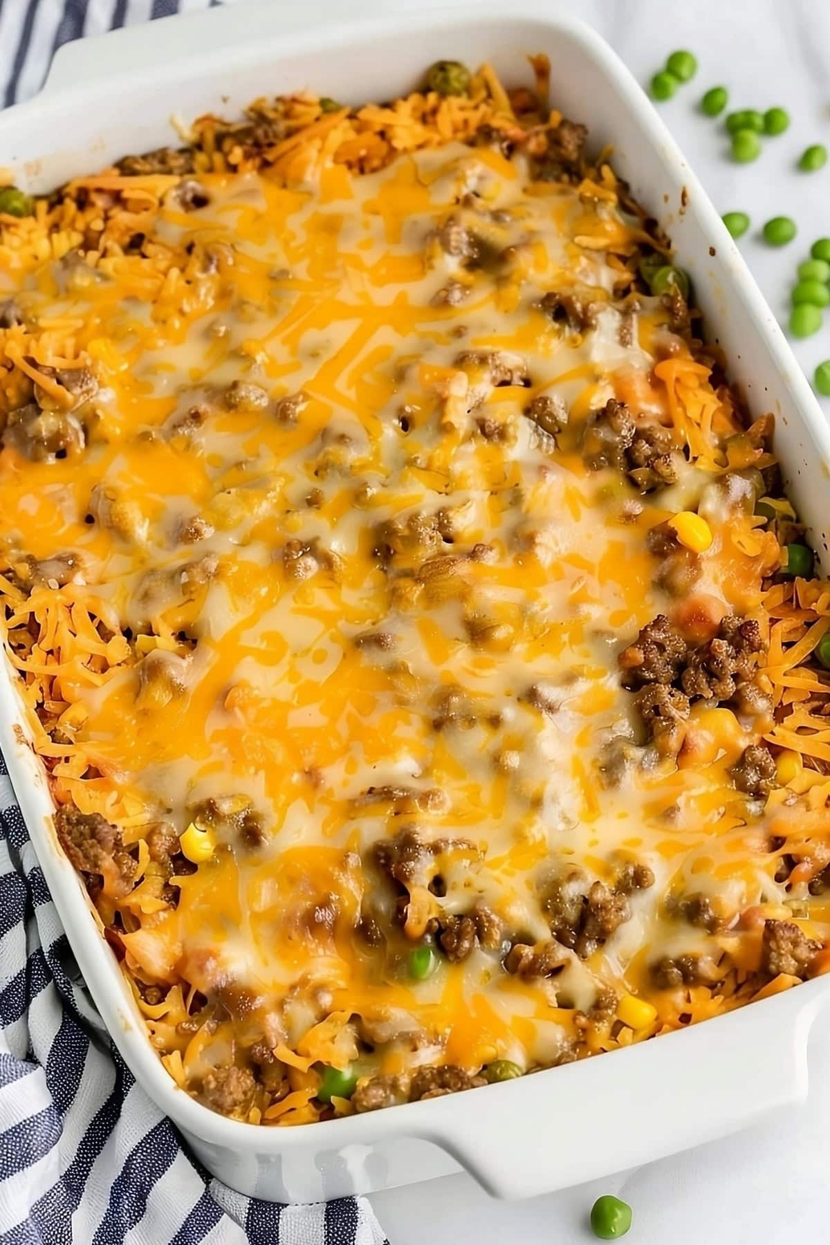 Hamburger hashbrown casserole with melted cheese on top.