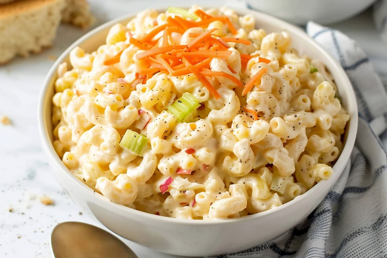 Homemade Hawaiian-style macaroni salad with carrots and celery, a refreshing side dish that pairs perfectly with grilled meats and seafood