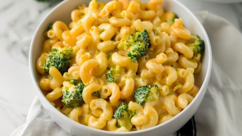 Hearty broccoli cheddar mac and cheese in a white bowl, a satisfying twist on the classic comfort food dish, sure to please the whole family