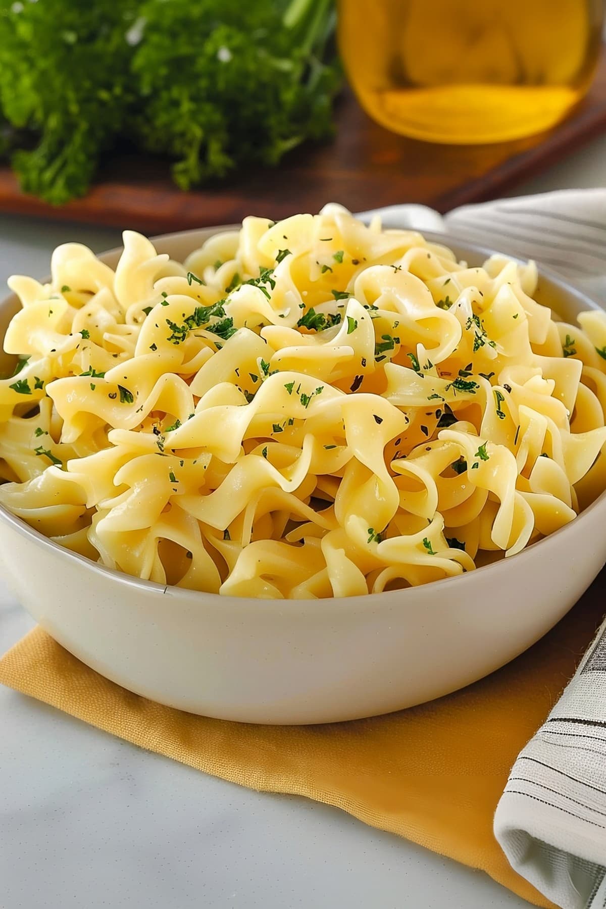 A bowl of Amish egg noodles with parsley