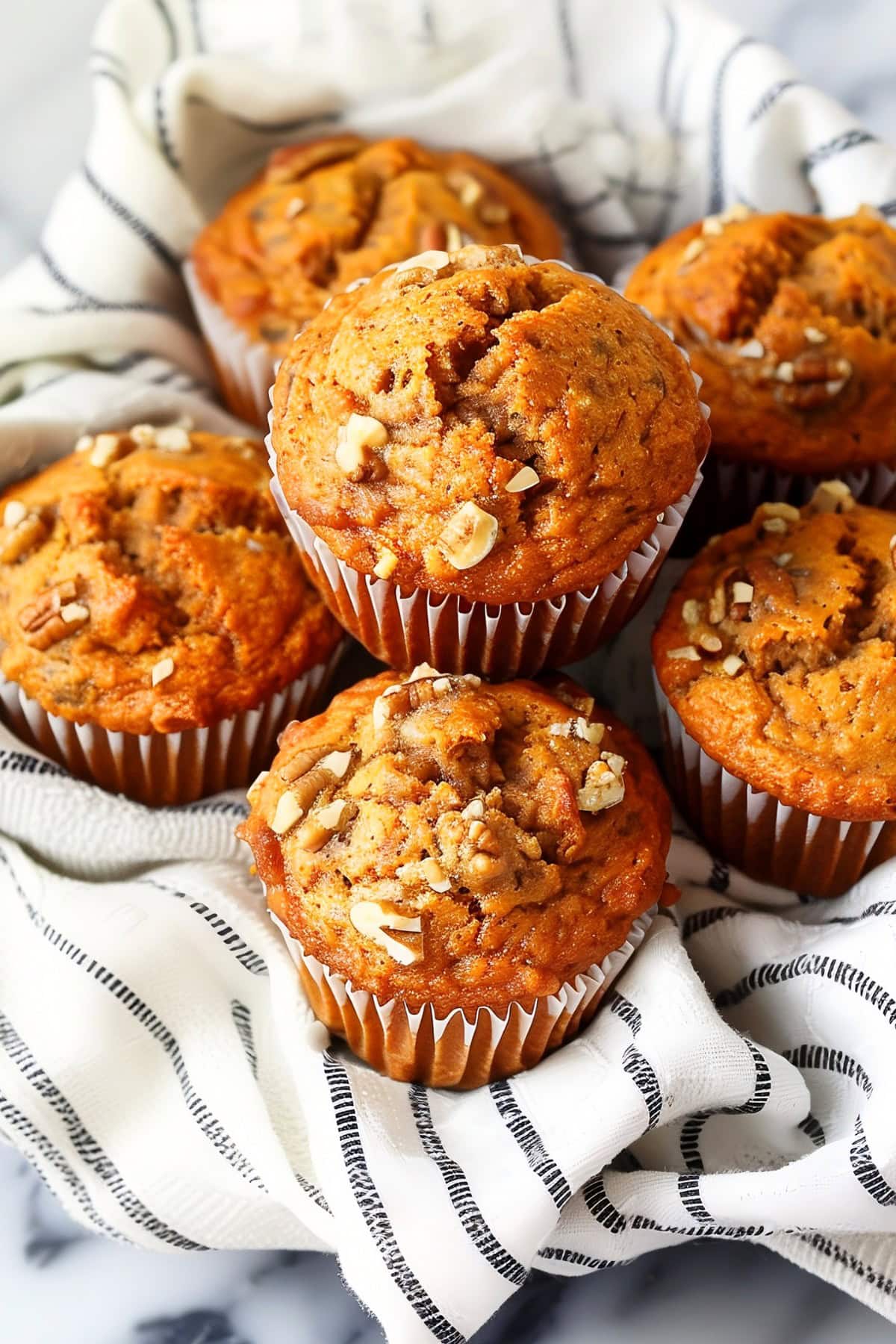 Homemade carrot muffins with cinnamon, ginger and nuts