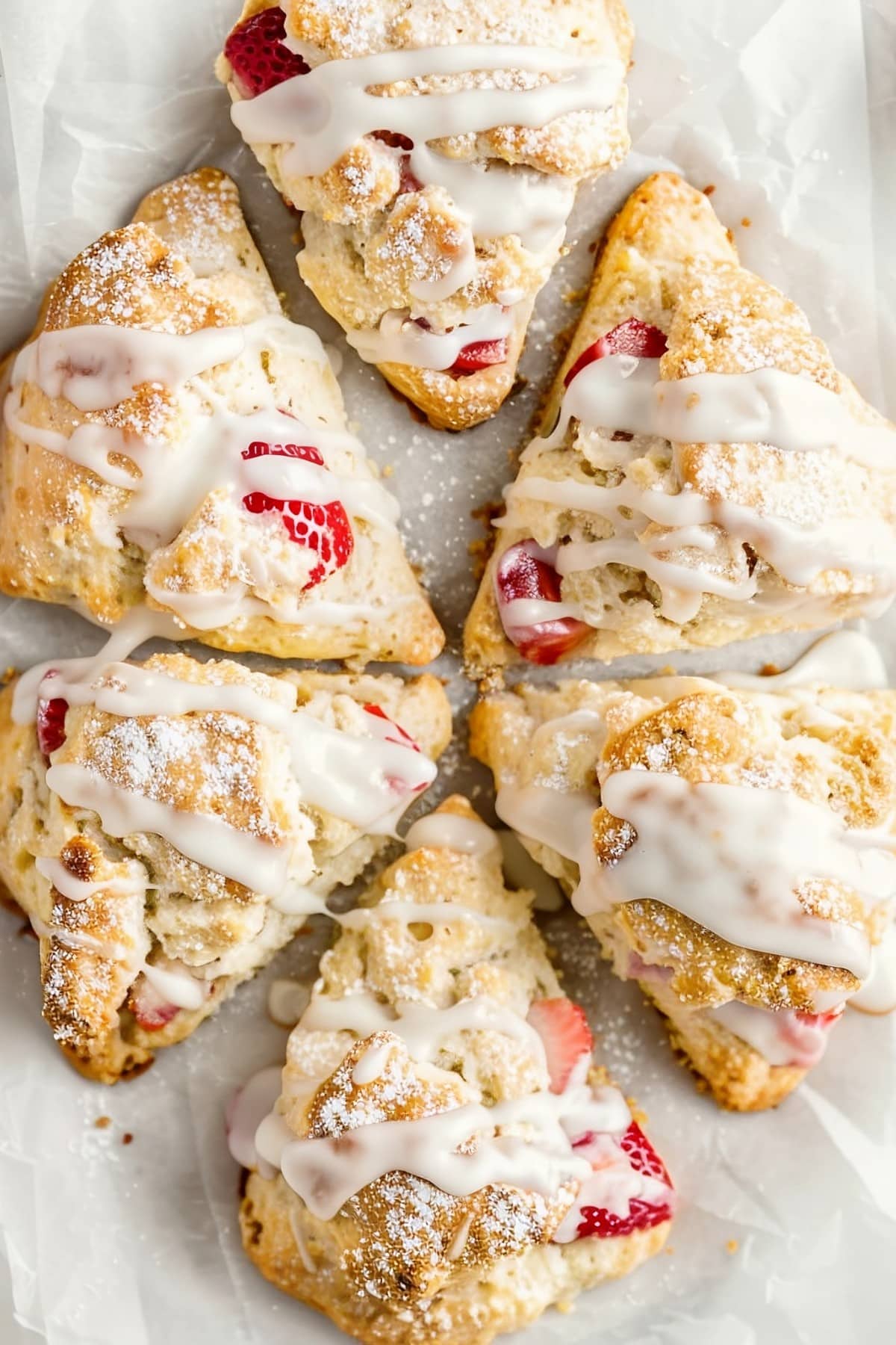 Freshly baked strawberry scones, bursting with sweet glaze