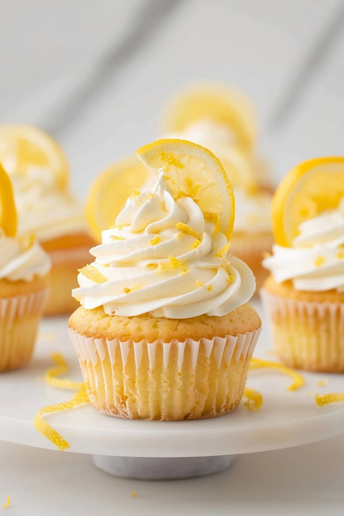Homemade lemon cupcakes, baked to perfection and topped with a swirl of tangy cream cheese frosting