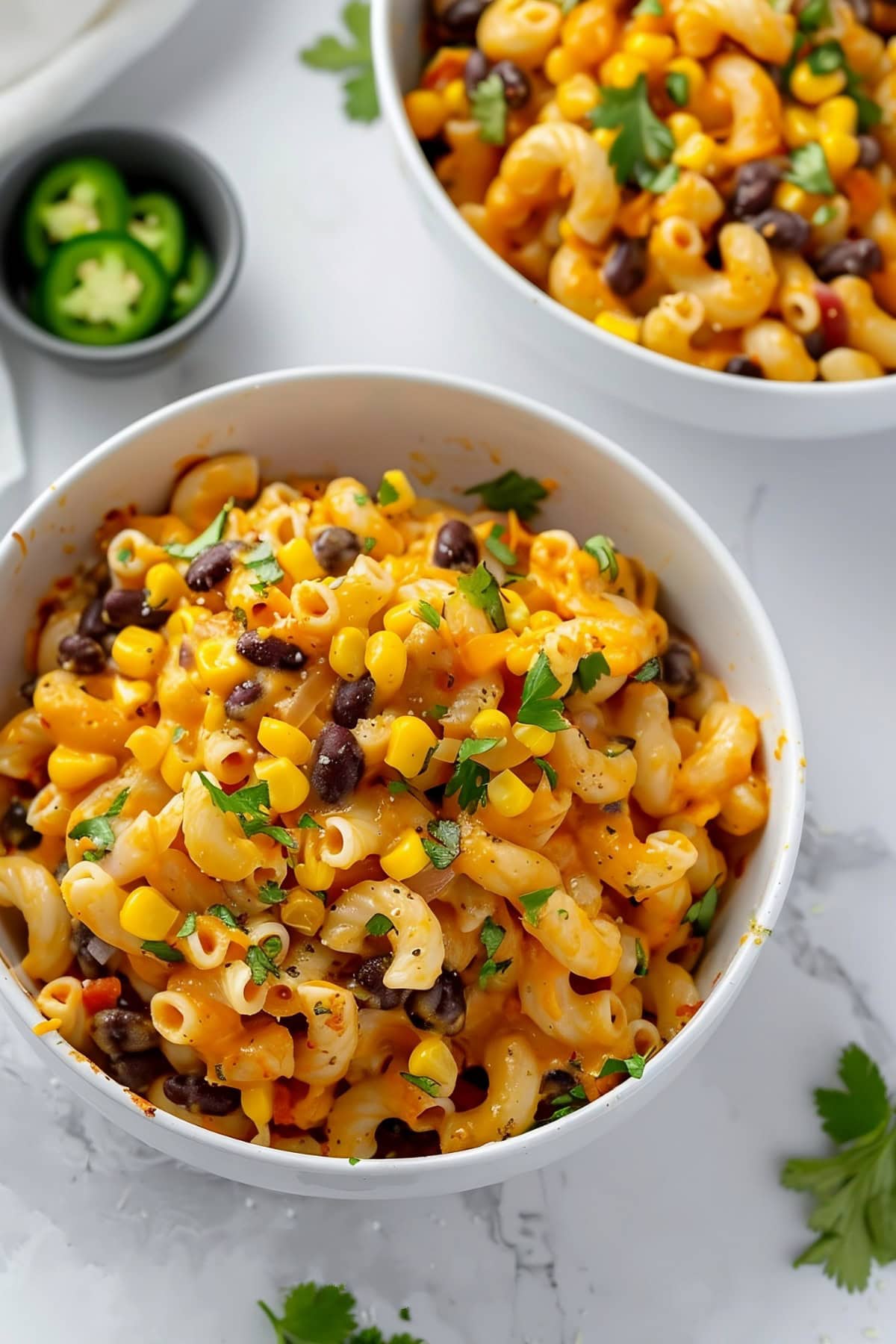 A bowl of Tex-Mex mac and cheese with corn, peppers and black beans