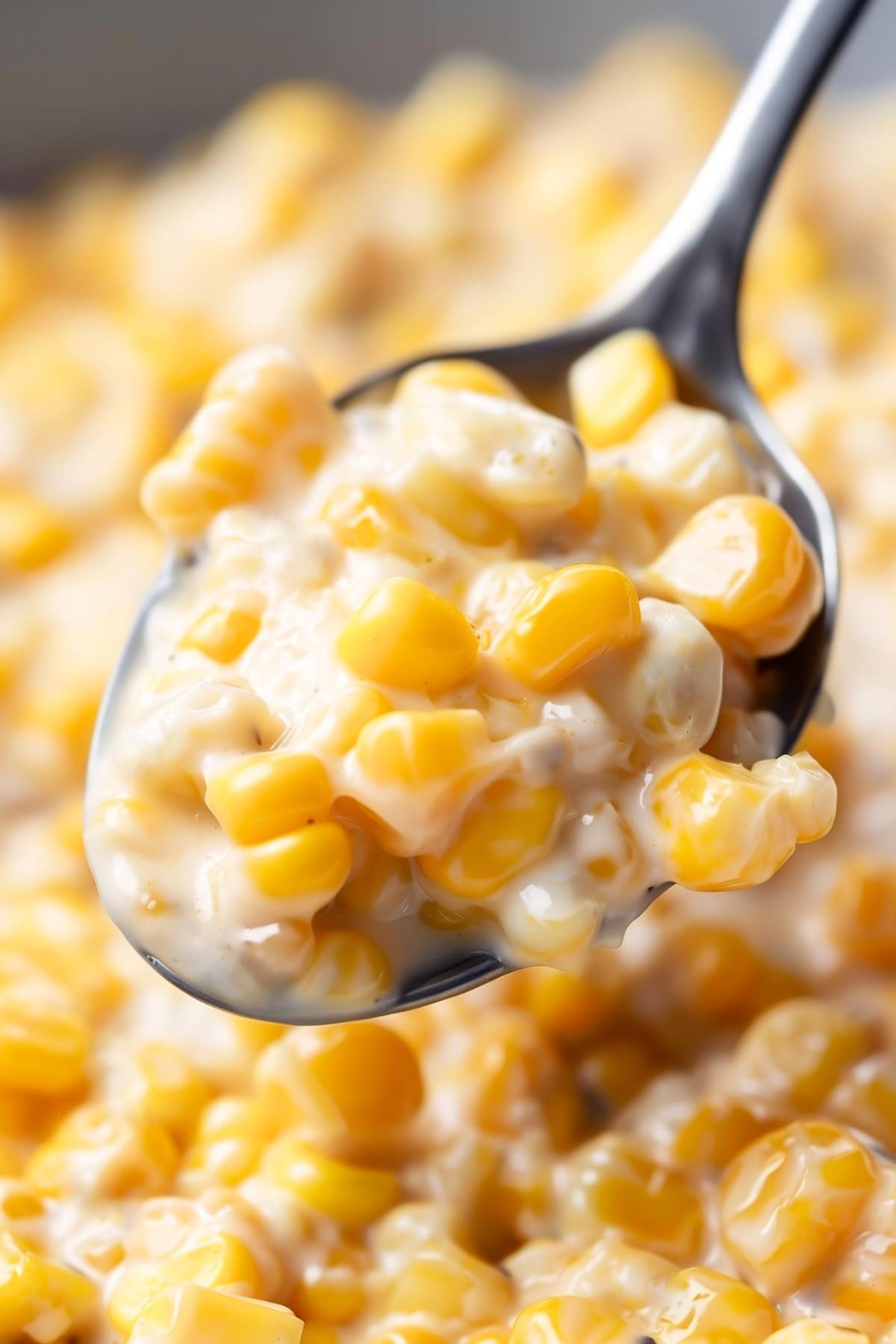 Close-up shot of a spoon of creamy honey butter corn