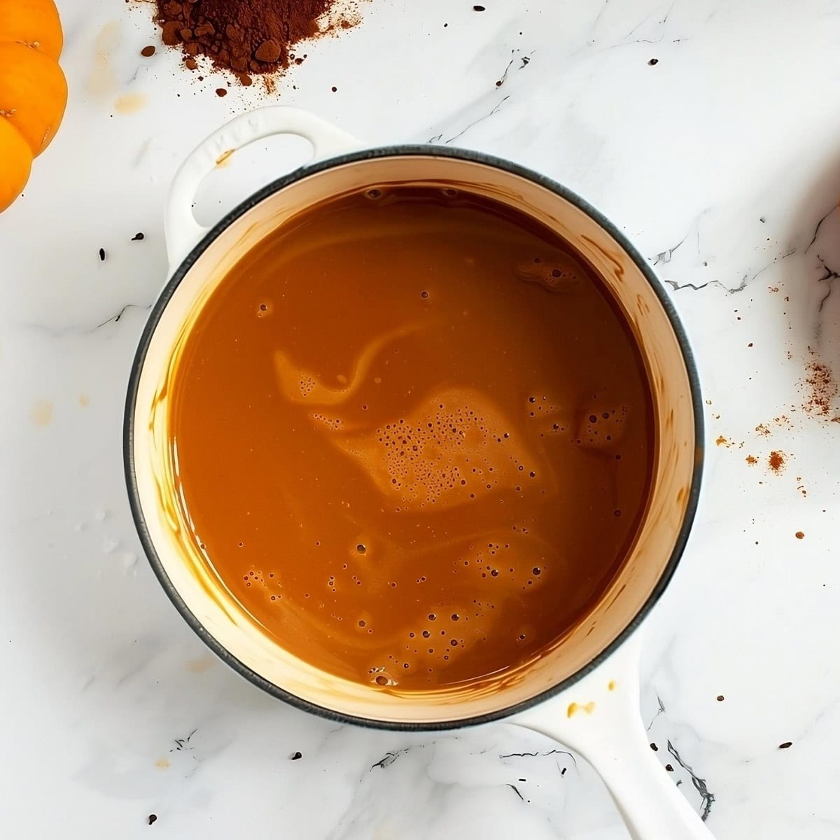 Pumpkin Spice Hot Chocolate in a saucepan, top down view.