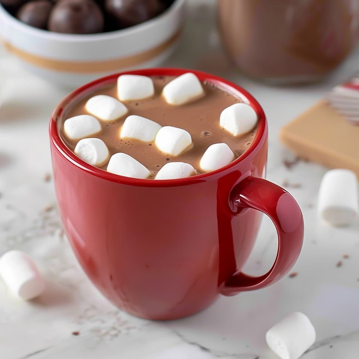 Hot chocolate in a red mug with mini marshmallows