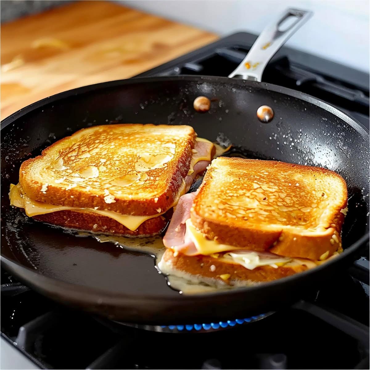 Homemade Monte Cristo sandwich battered in egg, cooked in a skillet