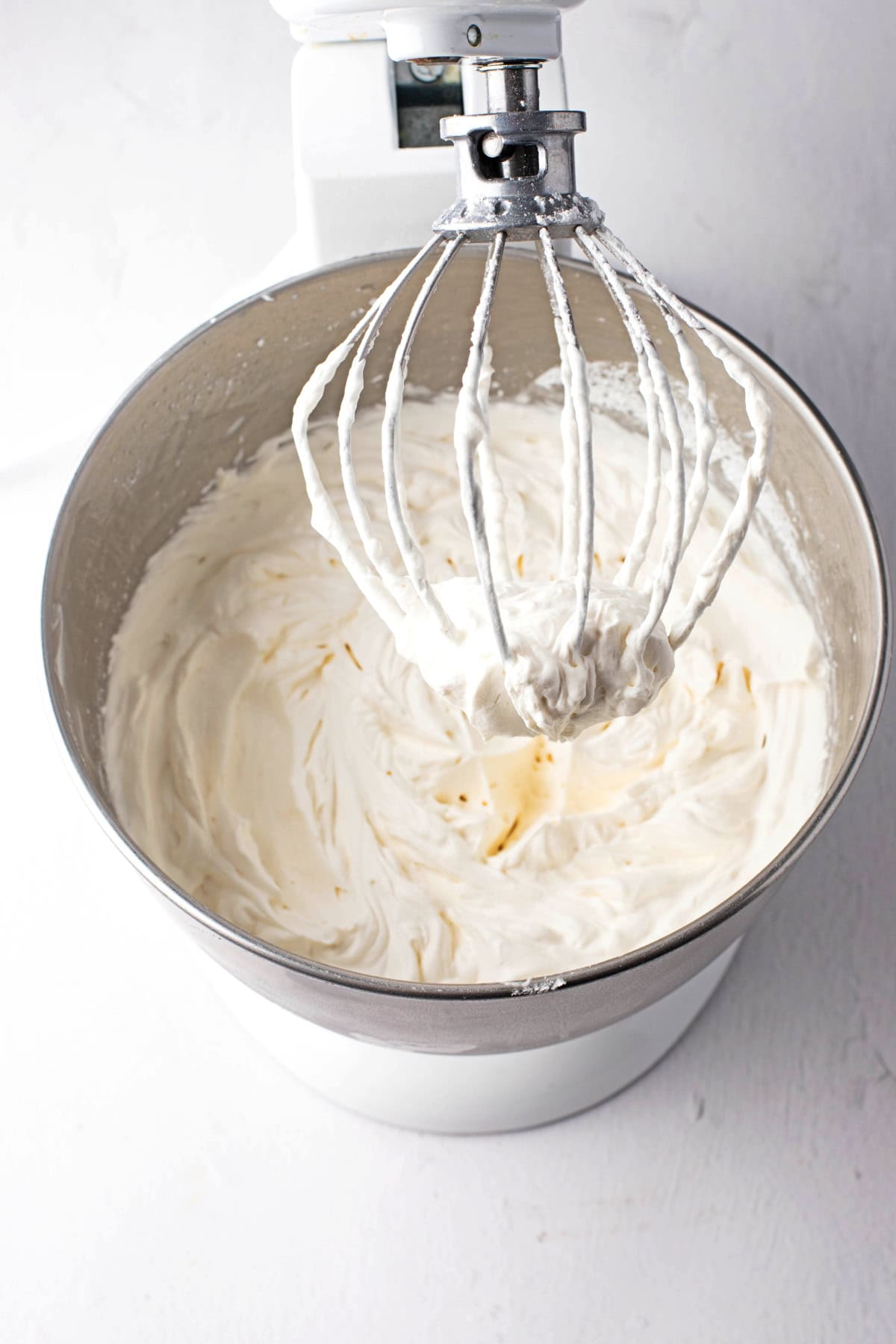 Whipped cream, sugar and vanilla in a large container