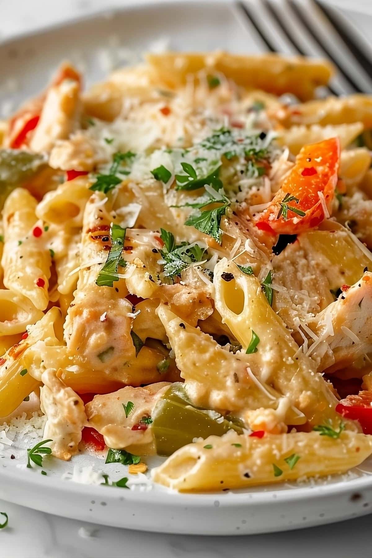 Rattlesnake pasta with chicken, bell peppers, jalapeños, and Parmesan sauce.