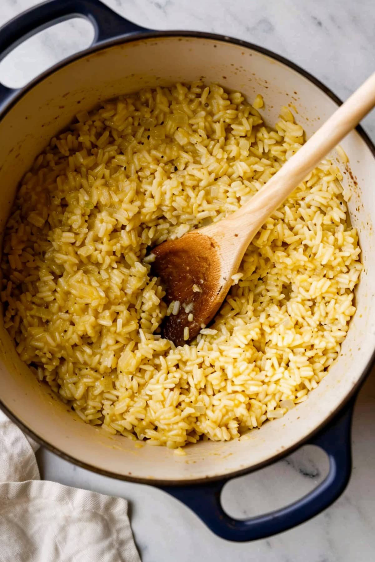Rice made with cream of chicken soup and parmesan cheese in a large pot