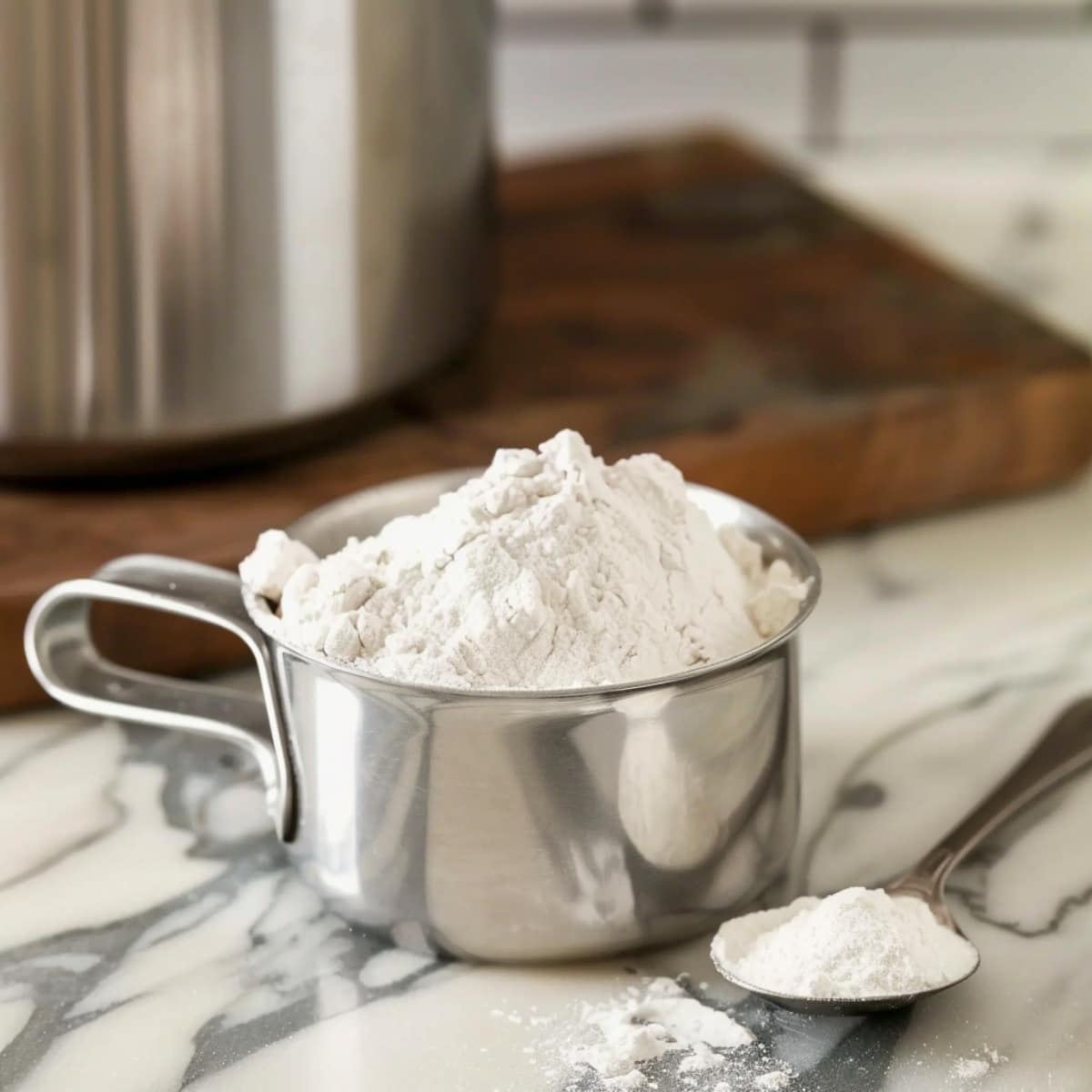 Spoon and level Flour in a measuring cup