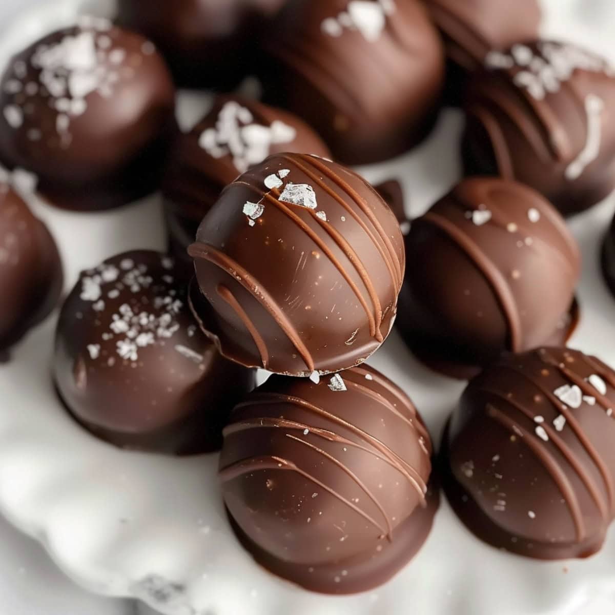 Stacked homemade brownie truffles with sea salt