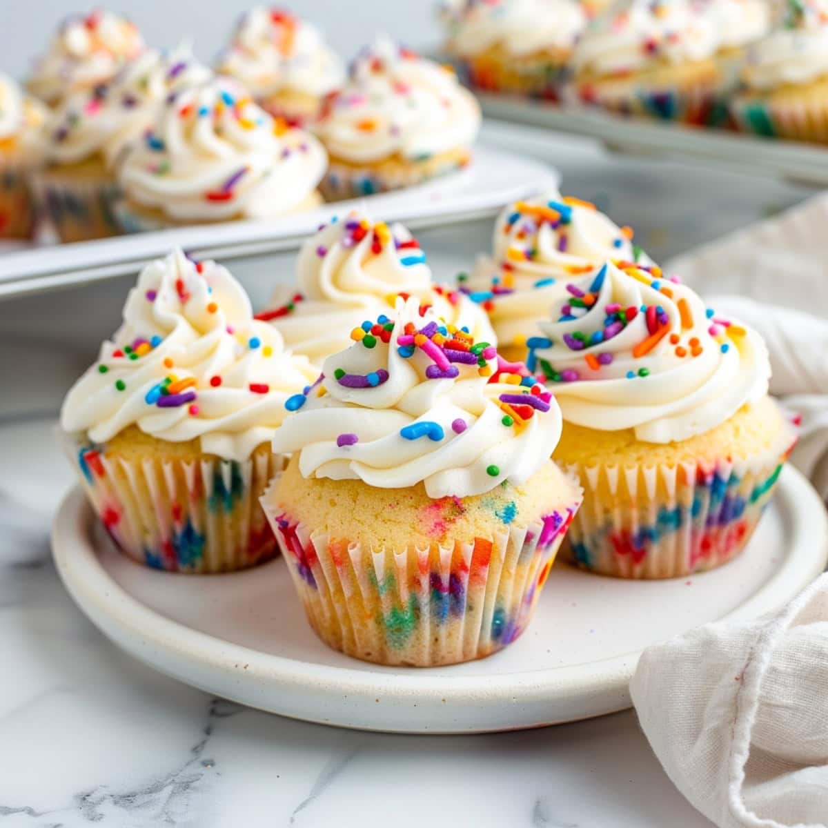 Homemade funfetti cupcakes, baked to perfection and crowned with a generous dollop of frosting.