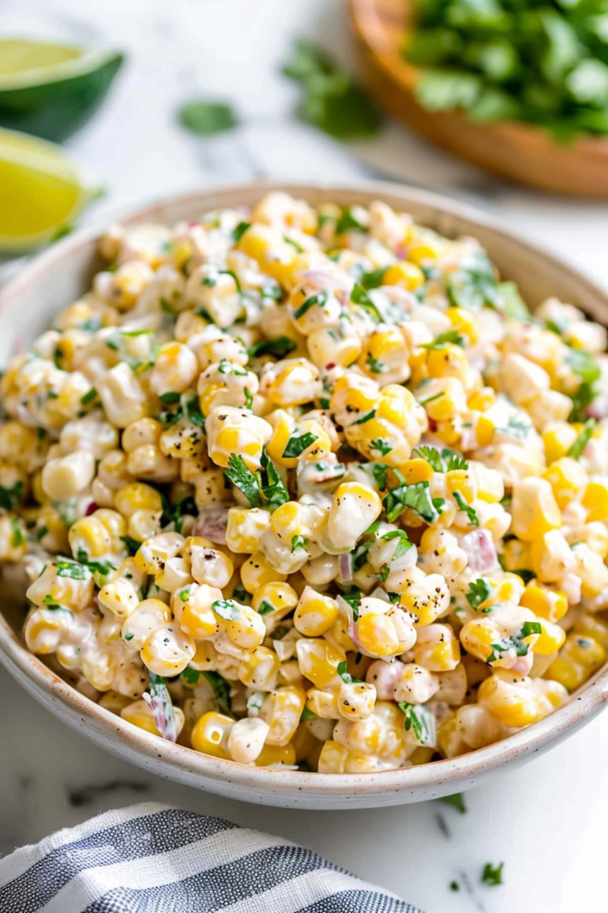 Irresistible Esquites, garnished with crumbled cotija cheese and chopped green bell peppers.