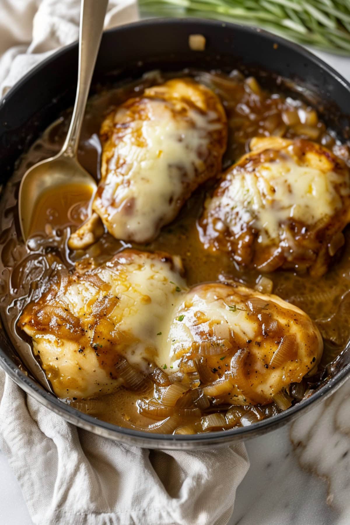 French onion chicken topped with bubbling cheese and thyme 