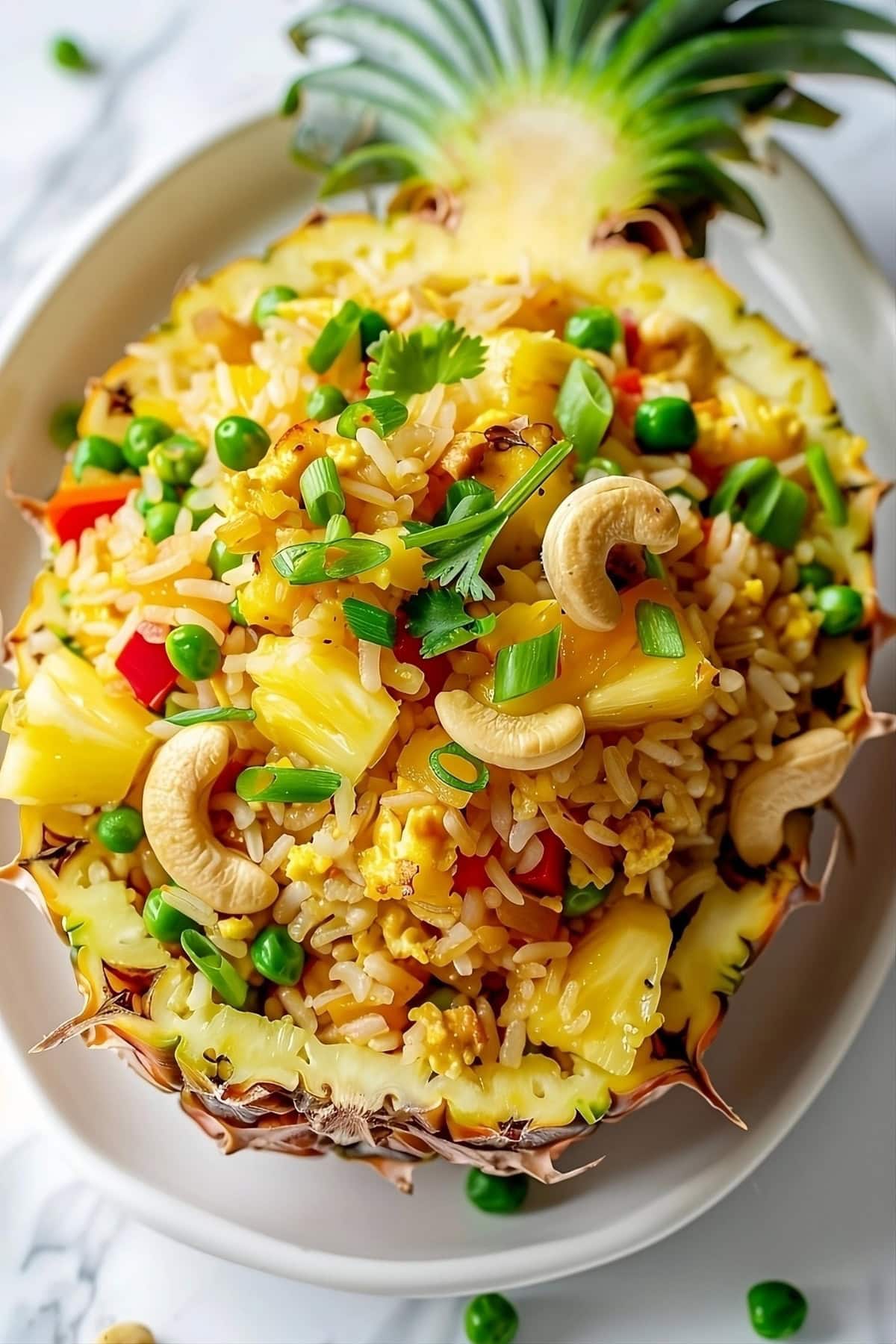 Fried rice served in a pineapple halves.