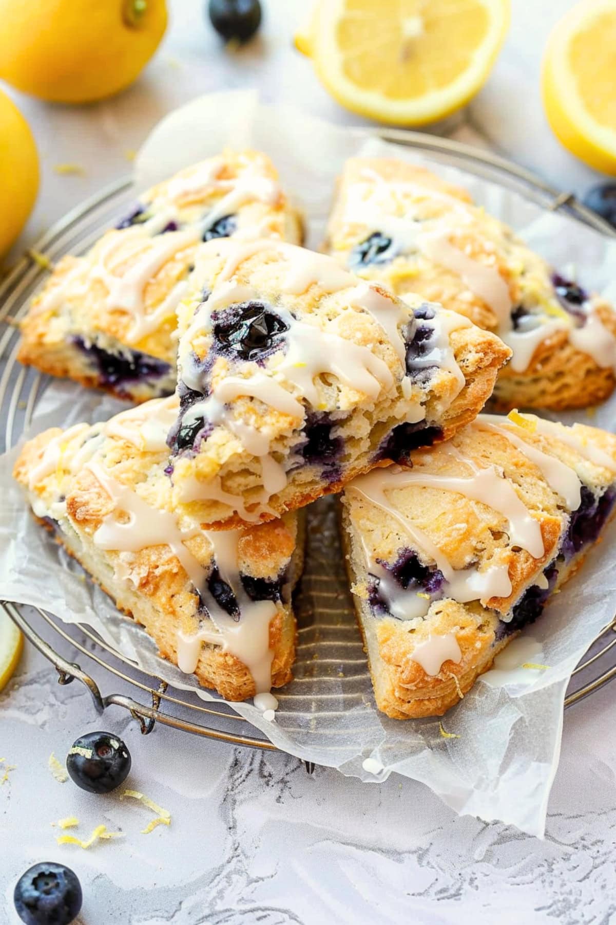 Flaky homemade blueberry scones with a hint of lemon in a cooling rack.