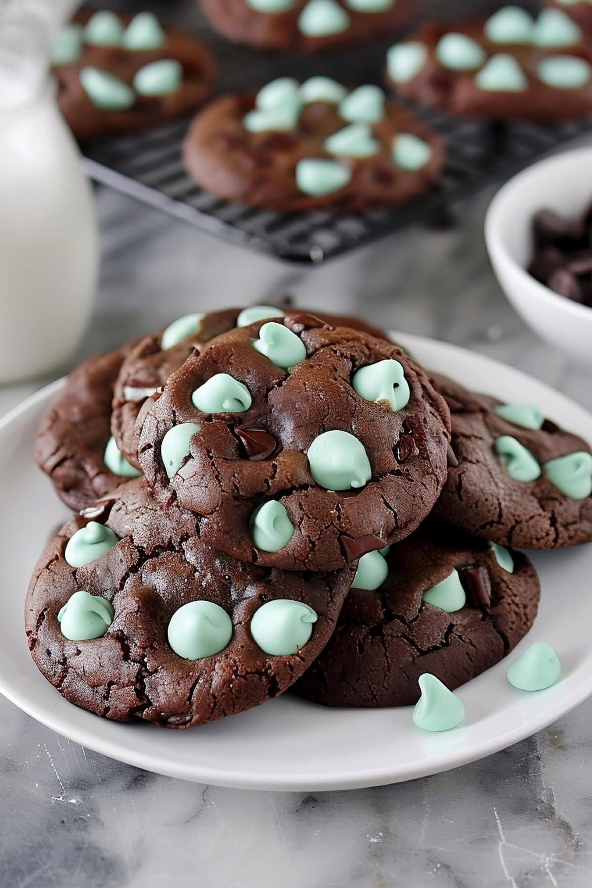 Chewy homemade chocolate mint chip cookies served with milk.