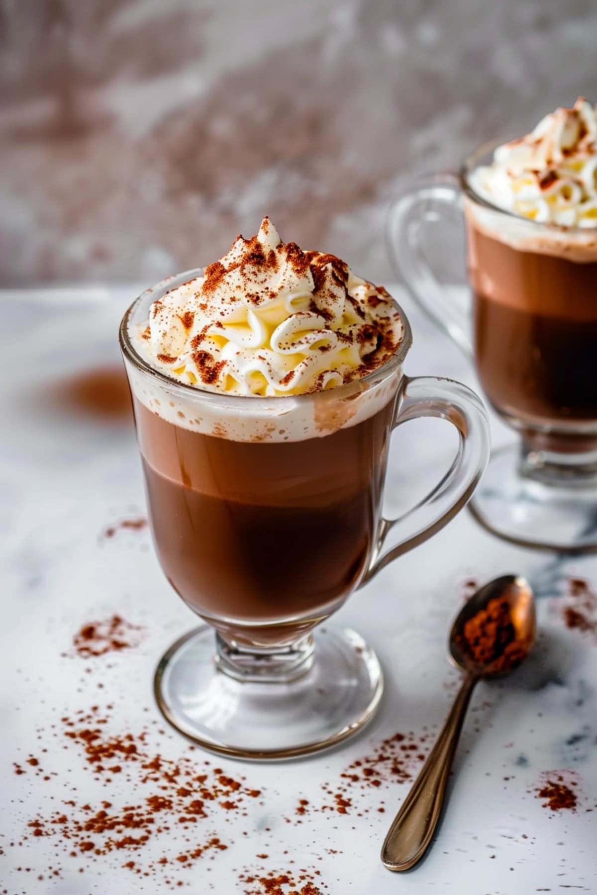 Homemade Kahlua hot chocolate with whipped cream with powdered cocoa