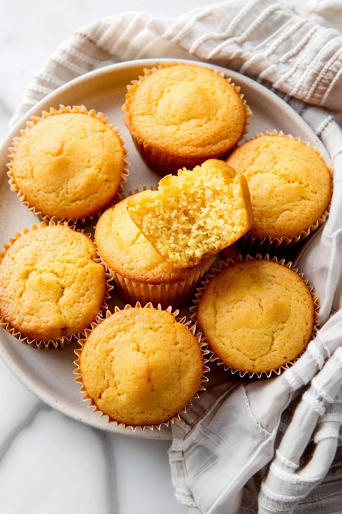Golden honey cornbread muffins, baked to perfection with a moist and fluffy texture