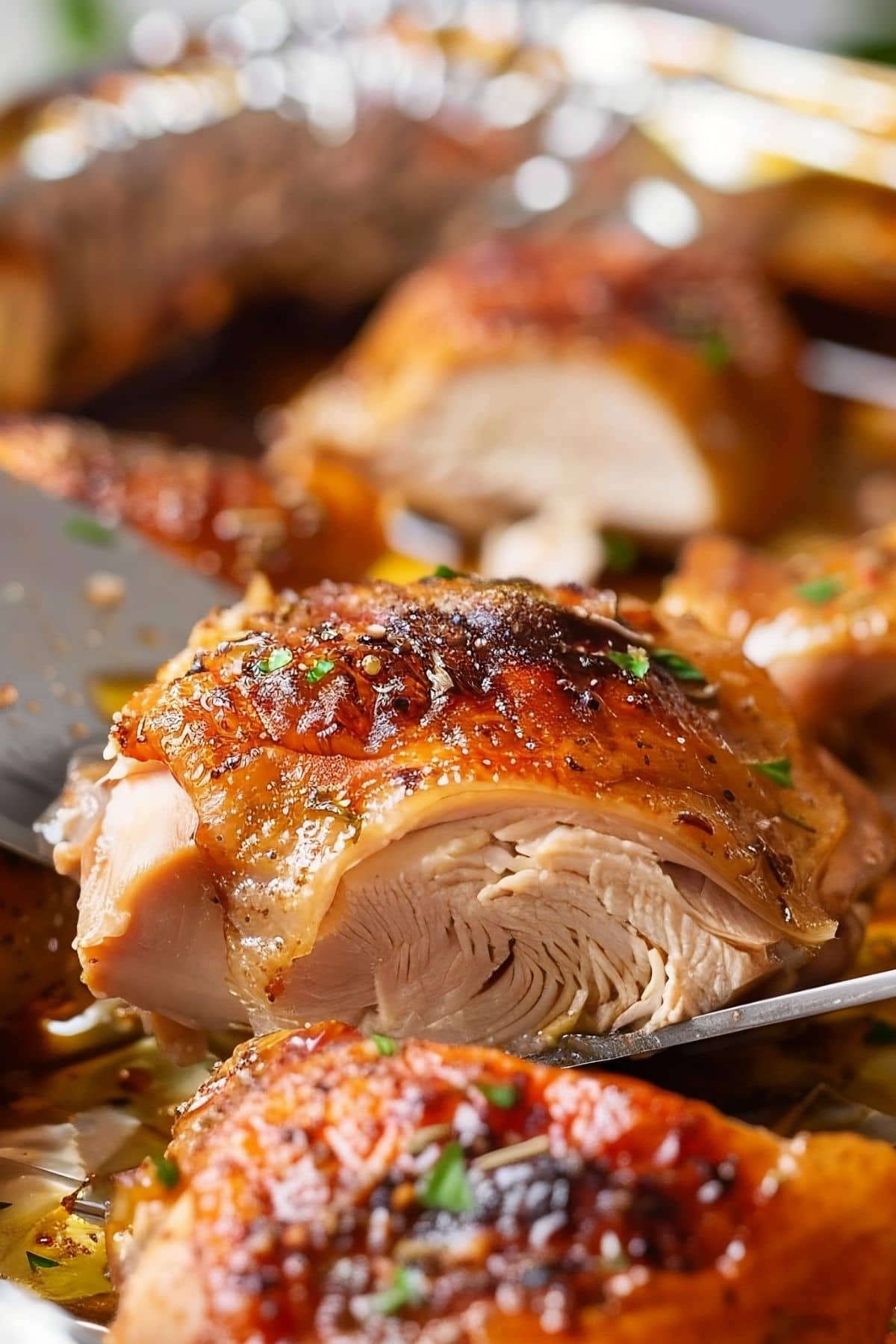 Close Up of Cut Piece of Crispy-Skinned, Juicy, Baked Chicken Thigh
