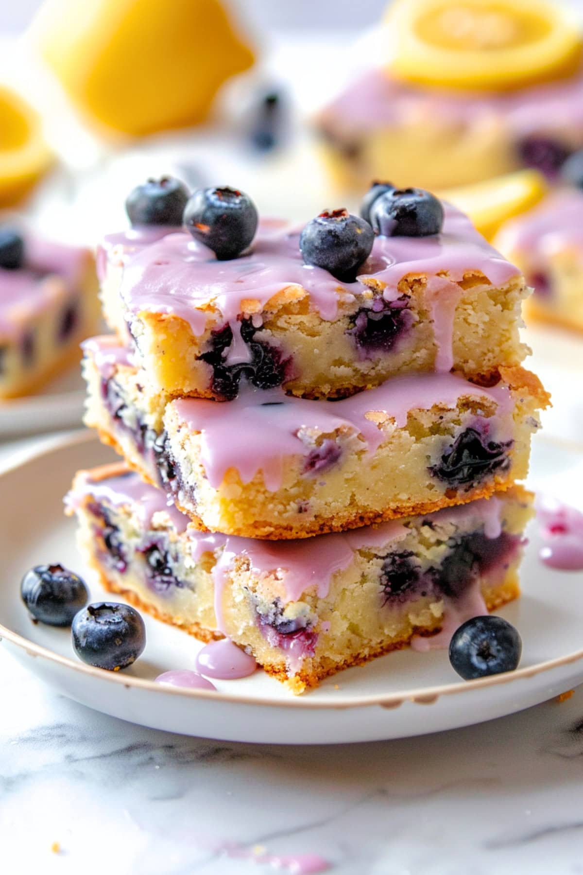 Stack of lemon blueberry blondies in a plate.
