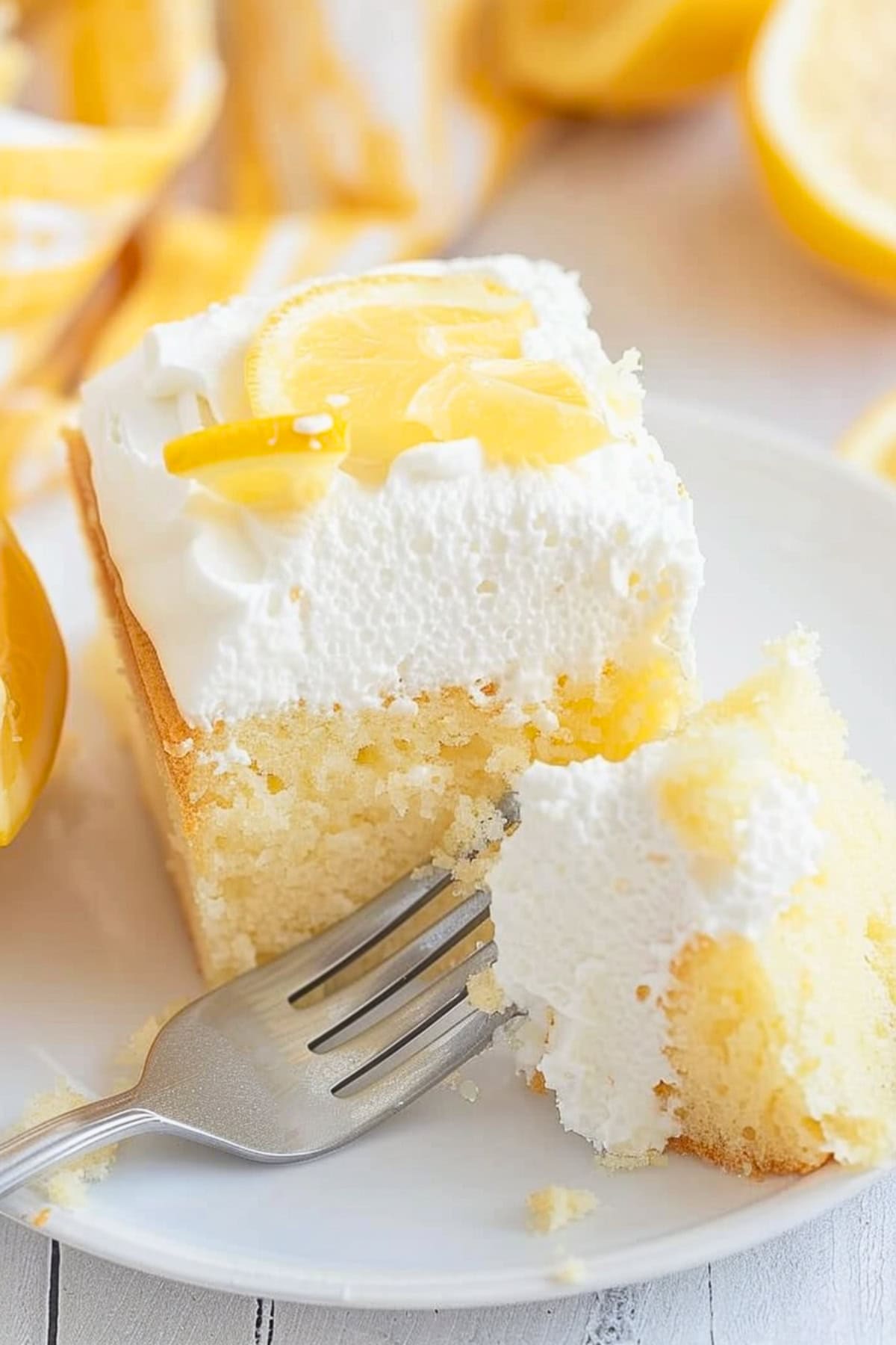 Slice of lemon crazy cake with fork.