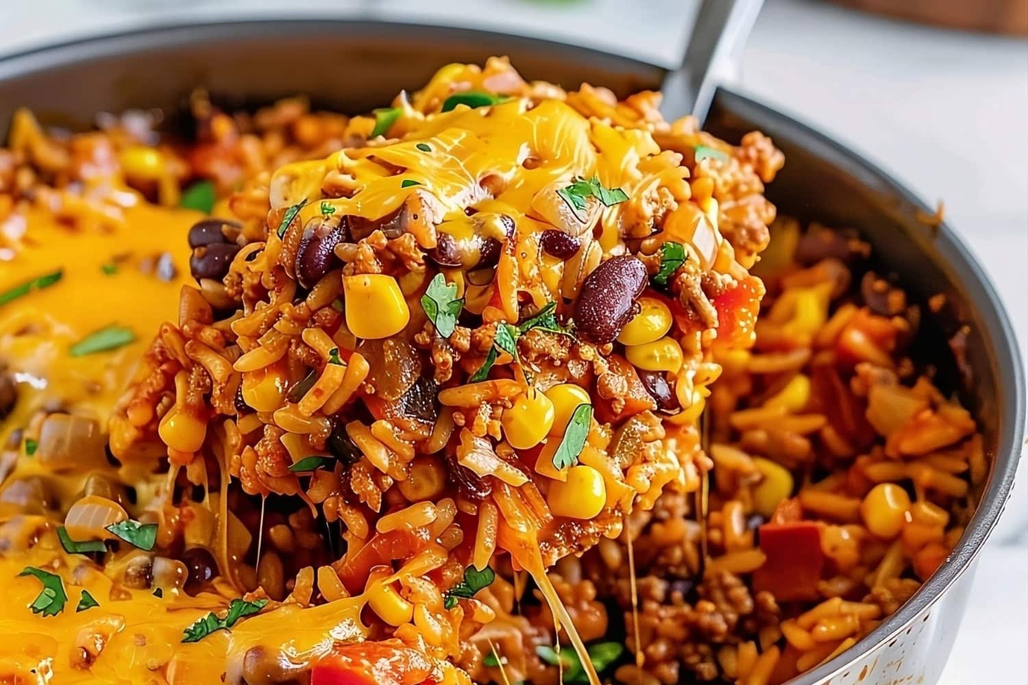 Cheesy Mexican rice casserole in a pan.