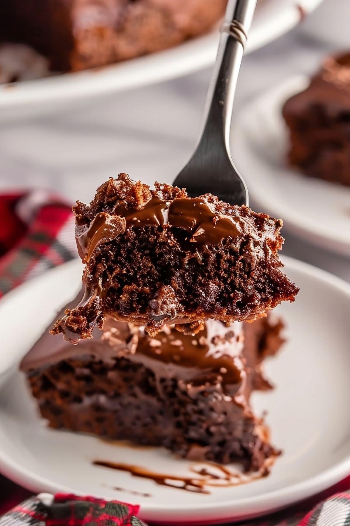 Close Up of a Bite of Coca Cola Cake on a Fork 
