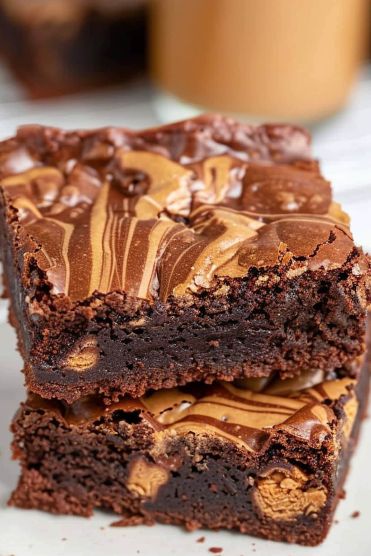 Two slices of peanut butter brownies stack on each other.