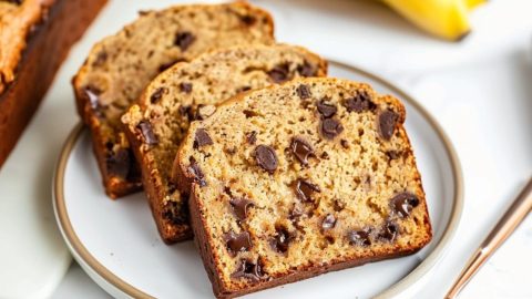 Slices of peanut butter banana bread with semi-sweet chocolate chips in a plate.