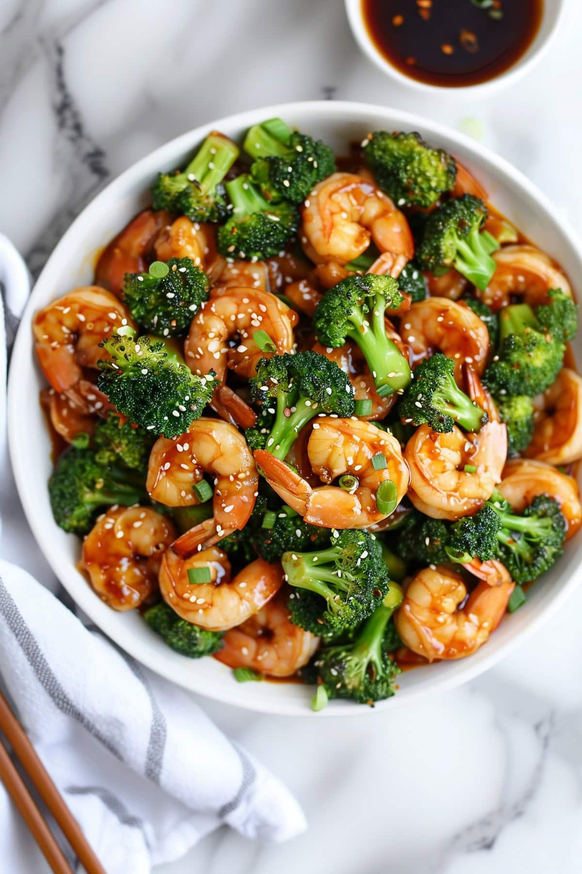 A bowl of homemade stir-fry shrimp and broccoli, a comforting dish that's perfect for busy weeknights or lazy weekends