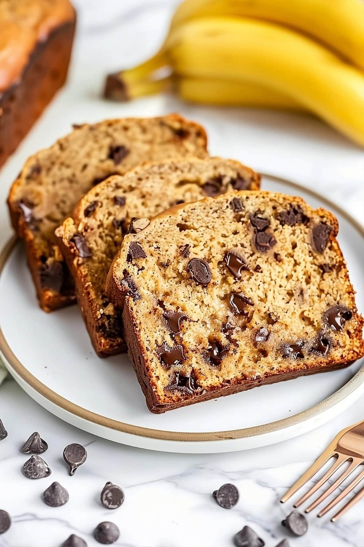 Slices of banana peanut butter bread loaf served in a plate.