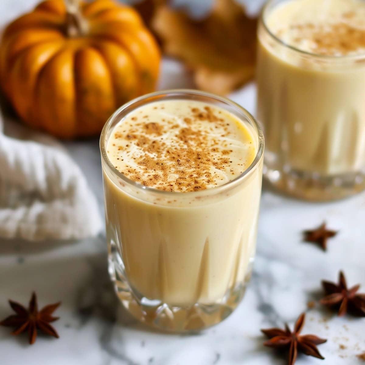 Creamy pumpkin eggnog, a seasonal twist on the classic holiday drink, with a hint of nutmeg spice