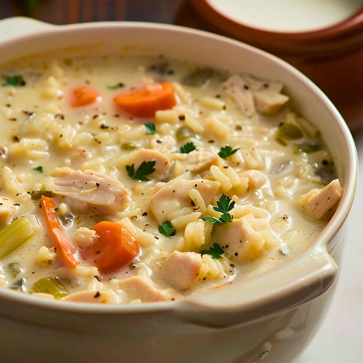 White Dutch Oven with Creamy Chicken Rice Soup- Close Up