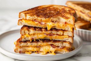 Hearty bacon grilled cheese sandwich, toasted to perfection with a golden, crispy crust.