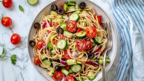 California pasta salad with colorful vegetables in a bowl.