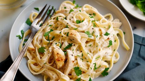Creamy pasta, featuring tender chicken strips and fettuccine in a rich alfredo sauce.
