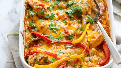 Chicken fajita casserole in a 9x13 inch baking dish.