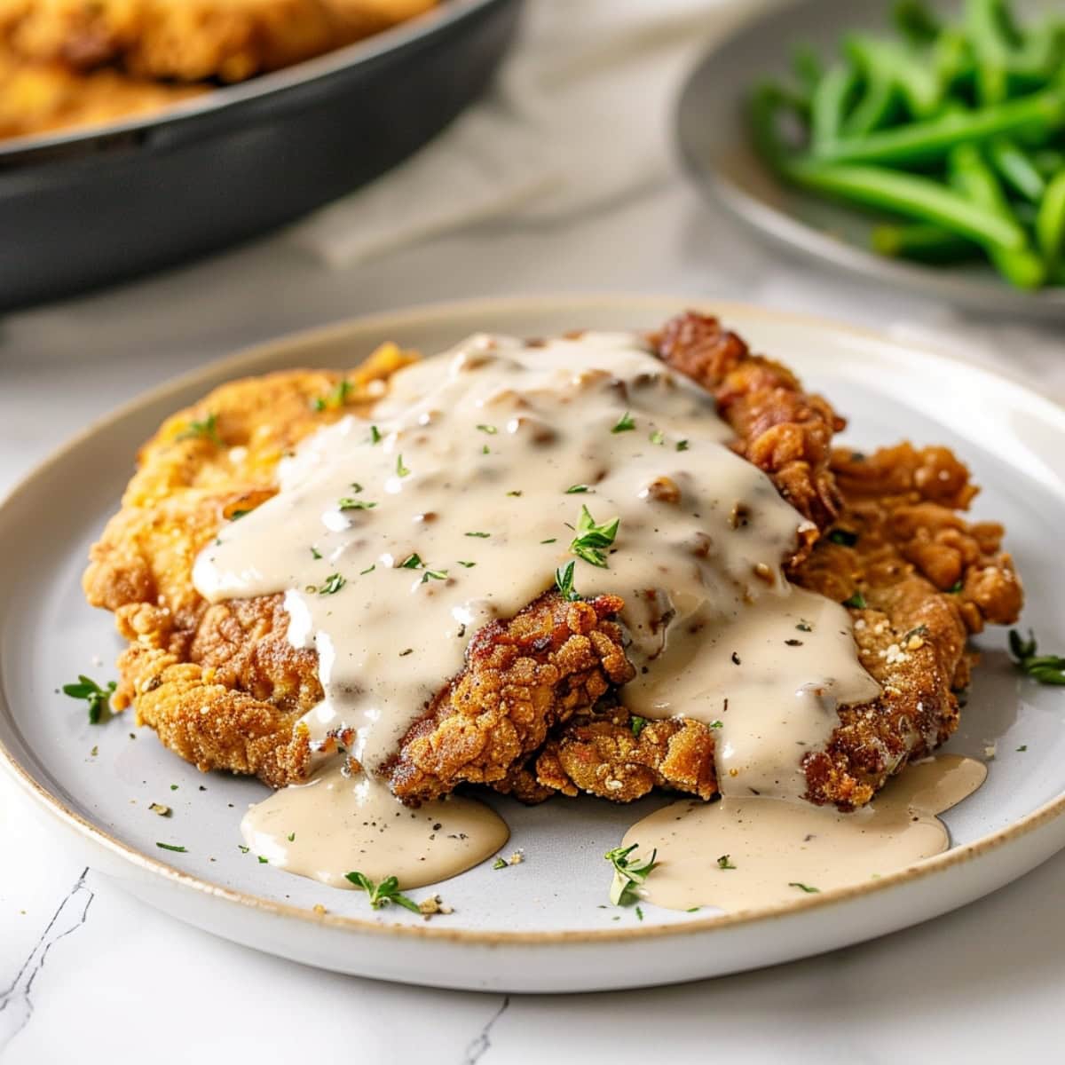 Traditional Southern-style chicken fried steak with creamy gravy.