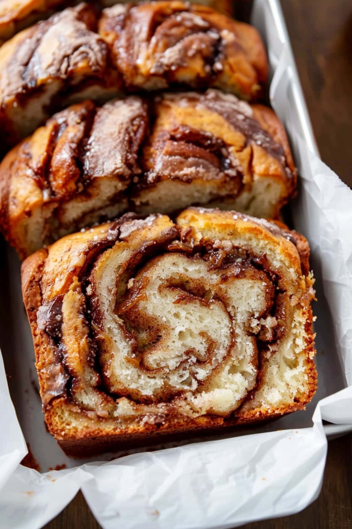 Cinnamon swirl quick bread in a loaf pan.