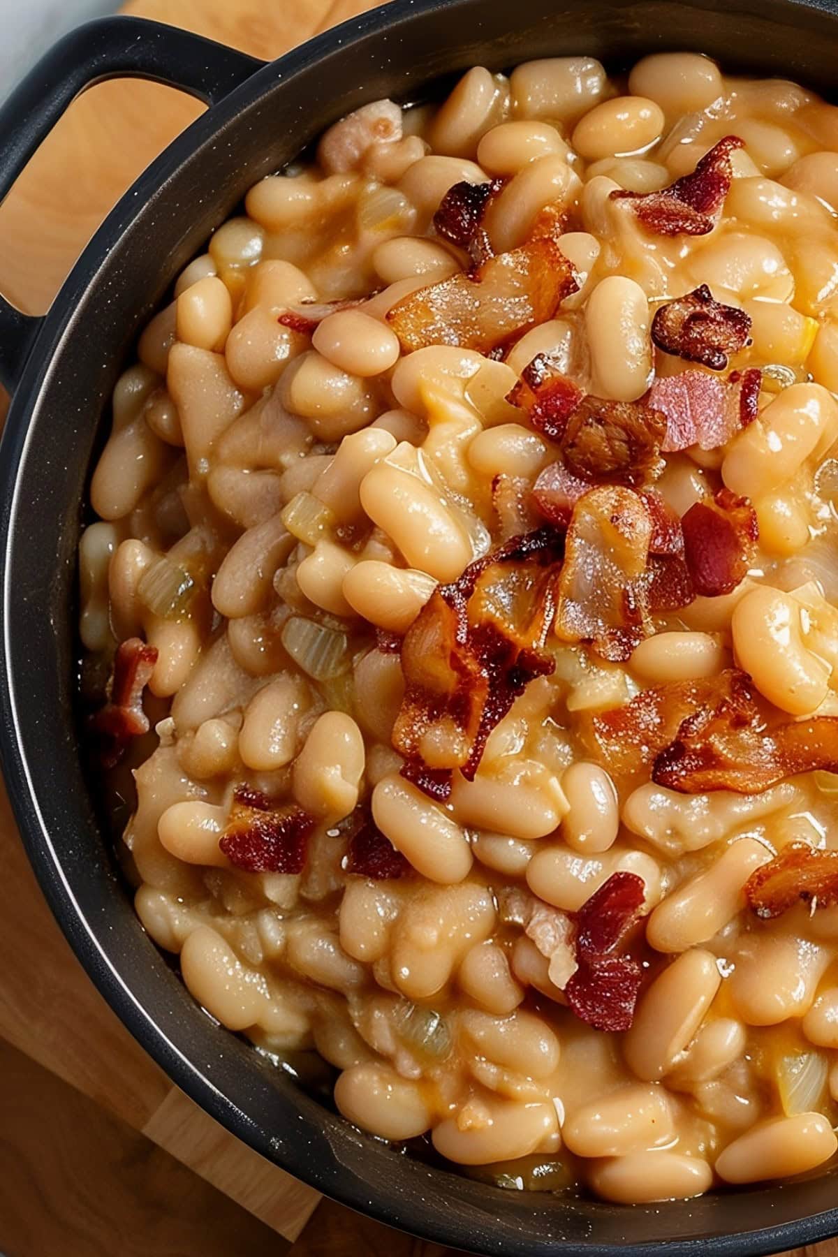 Close Up of Grandma Brown's Baked Beans with Bacon in a Skillet