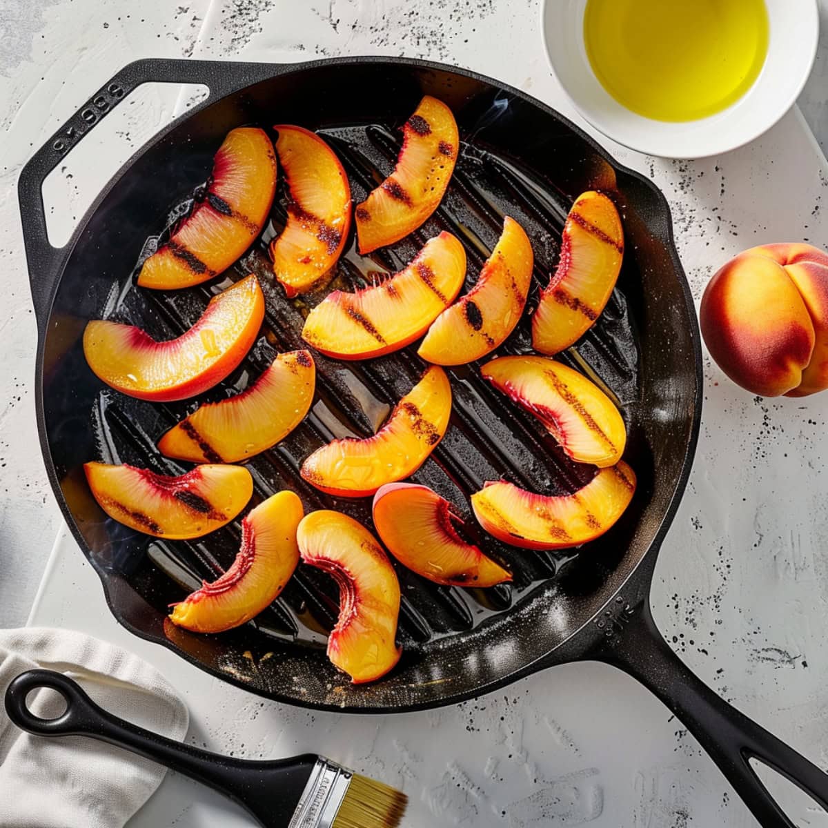 Slices of peaches grilled in a cast iron pan. 