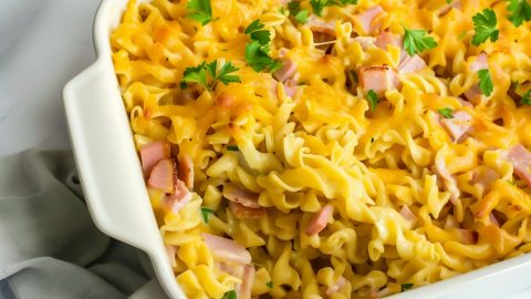 Overhead view of cheesy and hearty homemade ham and noodle casserole.