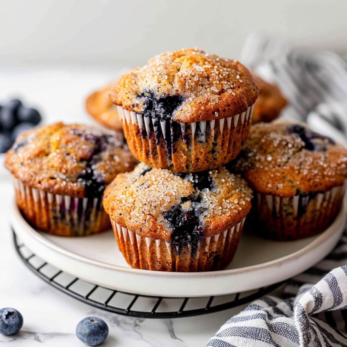 Plate of blueberry banana muffins on a marble counter top
