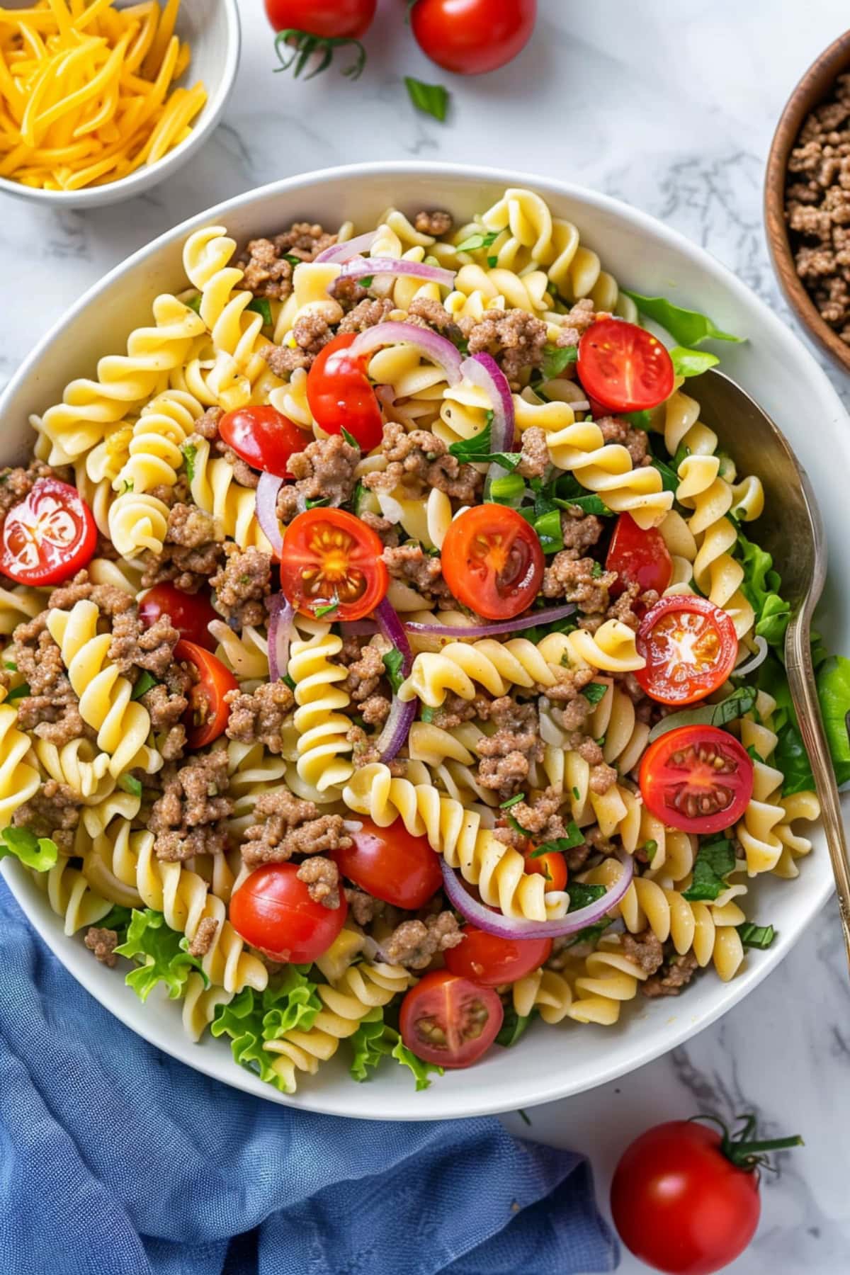 Refreshing Jimmy Buffett pasta salad with ground beef, red onions and lettuce.