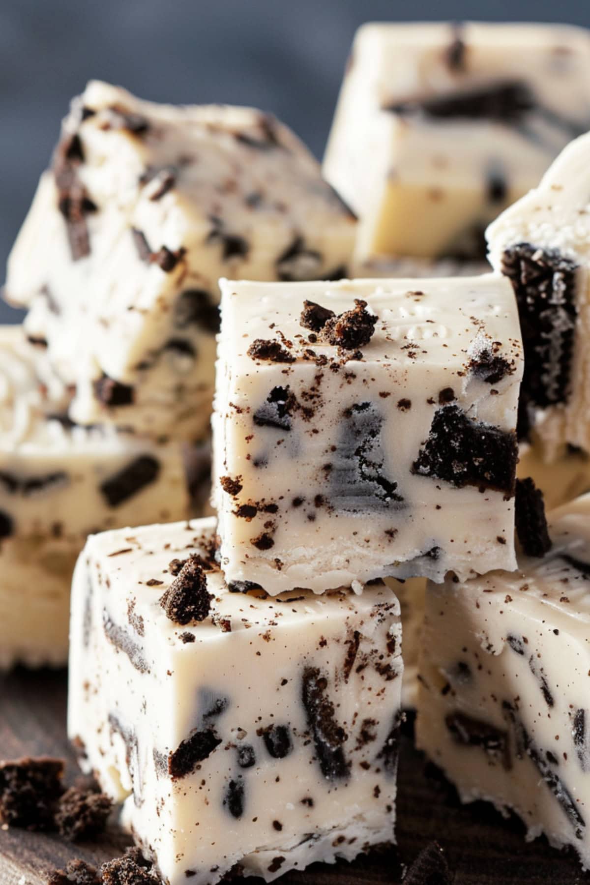 bunch of cube slice Oreo fudge on a wooden board.