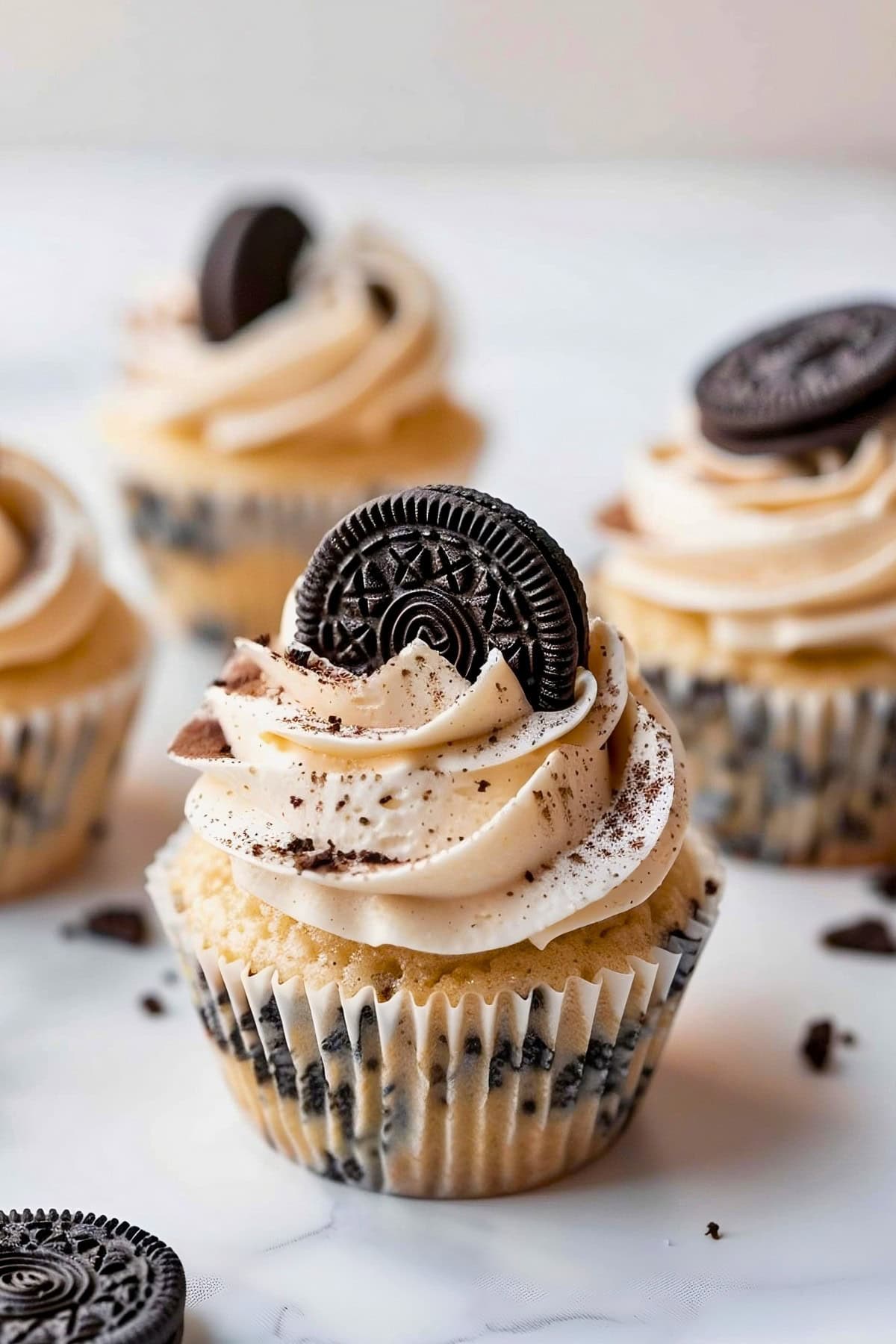 Sweet Oreo cupcakes with buttercream frosting and a whole Oreo on top